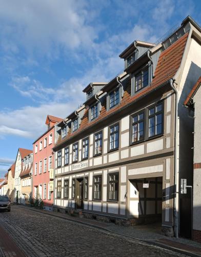 a building on the side of a street at Hotel Waren-Alte Warener Zeitung in Waren