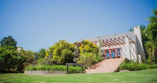 a building with a sign in front of it at Wildebraam Berry Estate in Swellendam