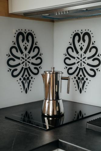 a metal blender on a counter in a kitchen at Osada Witów - dom „Dziewięćsił” in Witów