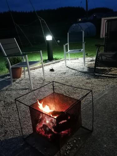 a fire pit in the middle of a park at night at An Charraig Ban on the wild Atlantic way F94WT02 in Ardara