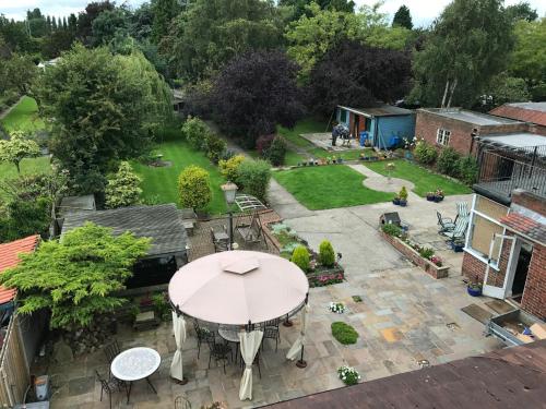 an aerial view of a patio with an umbrella at Acorn Guest House in Hull in Hull