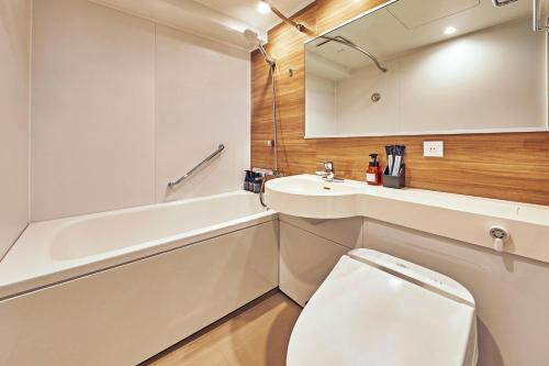 Ett badrum på Hotel Lumiere Kasai