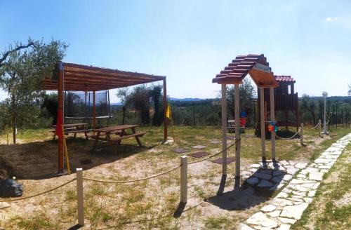 a playground with a picnic table and a bench at Tenuta Decimo - Villa Dini in San Gimignano