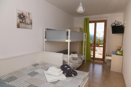 A bed or beds in a room at GreenHouse