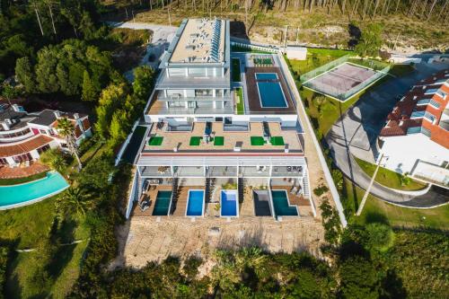 an overhead view of a building with blue doors at Ocean Views - New Private Condominium with Pool & Sea Views in Nazaré