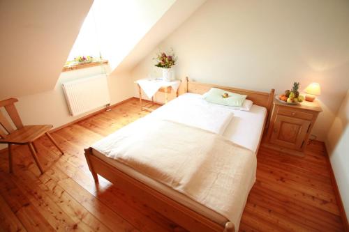 a bedroom with a large bed in a attic at Il Plonner - Hotel Restaurant Biergarten in Weßling