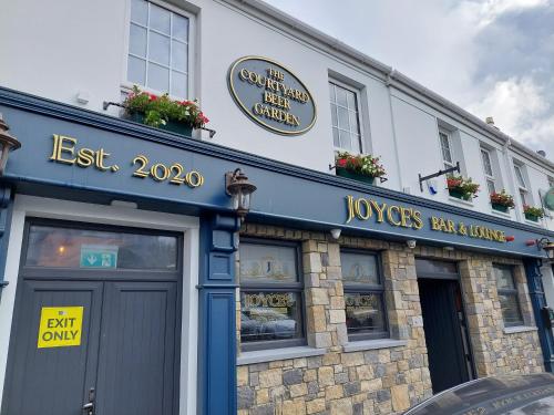 a restaurant with a sign on the front of a building at Joyce's Carndonagh Inishowen in Carndonagh