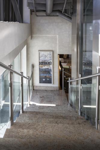 a staircase in a building with a painting on the wall at Hotel Plazaola in Irurtzun