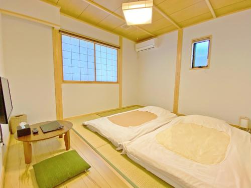 Кровать или кровати в номере Toraya