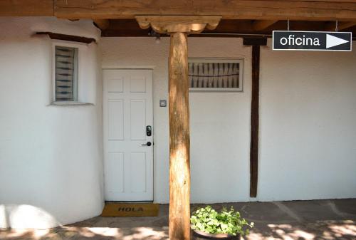 a street sign in front of a building with a door at The Parador in Santa Fe