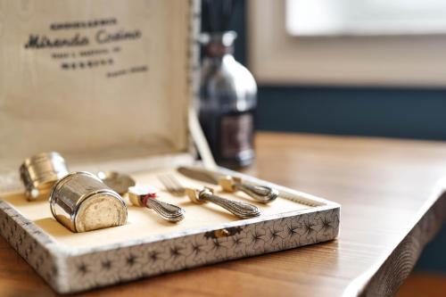 a tray with a bunch of keys on a table at Family Affair Luxury Rooms&Suites in Palermo