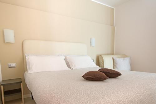 Säng eller sängar i ett rum på Residence Perla