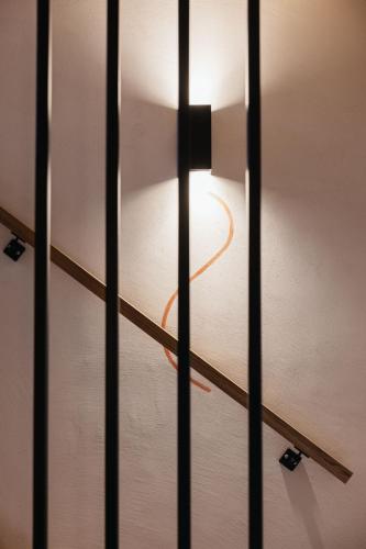 a close up of a glass door with a light at Alpine Chalet Sauter in San Vigilio Di Marebbe