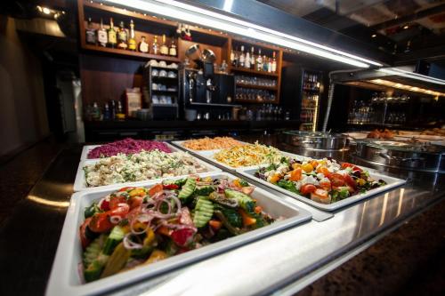 a buffet line with many different types of food at Hotel Cēsis in Cēsis