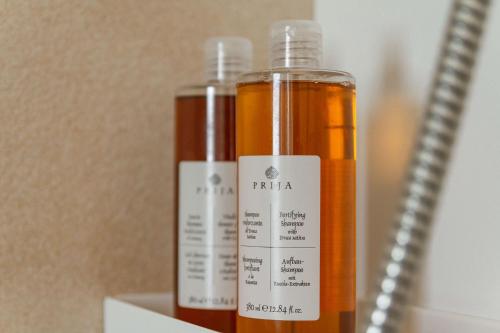 two bottles of oil sitting next to each other at Villa Anouk in Pitve