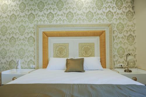 Ένα ή περισσότερα κρεβάτια σε δωμάτιο στο Apartmani President II