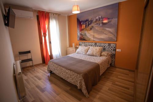 Кровать или кровати в номере Apartamentos Rurales Romero