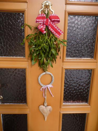 a door with a valentines wreath on it at Haus Rosi in Uttendorf