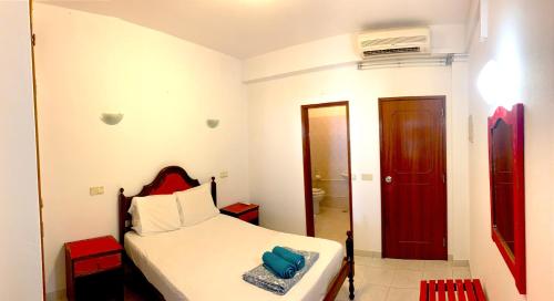 Ένα ή περισσότερα κρεβάτια σε δωμάτιο στο The Central Guesthouse