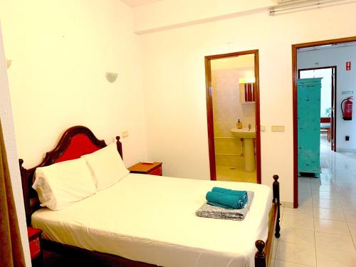 Ένα ή περισσότερα κρεβάτια σε δωμάτιο στο The Central Guesthouse
