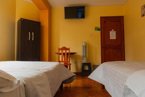 Postel nebo postele na pokoji v ubytování Refugio Hotel