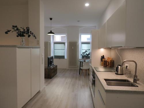 a kitchen with a sink and a counter top at L8 Street - Mannheim Innenstadt in Mannheim