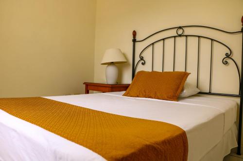 Letto o letti in una camera di Hotel Villa Serena San Benito
