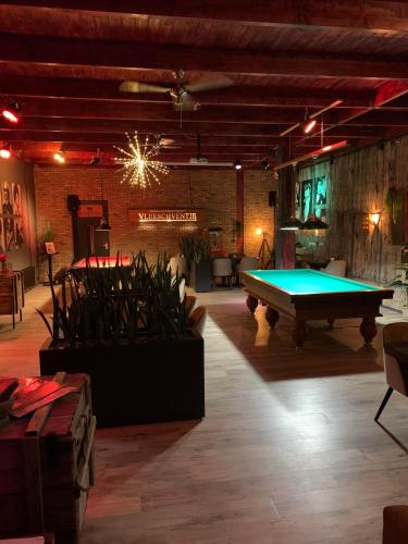 a pool table in the middle of a room at Stadshotel Vlissingen in Vlissingen