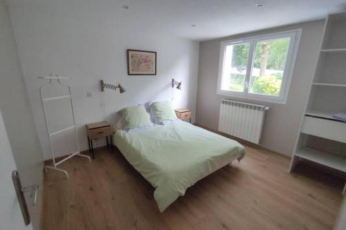 Vuode tai vuoteita majoituspaikassa Appartement au calme avec vue et piscine au coeur du pays basque