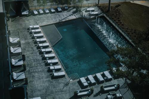 an overhead view of a swimming pool with lounge chairs at Hotel Legends in Biloxi