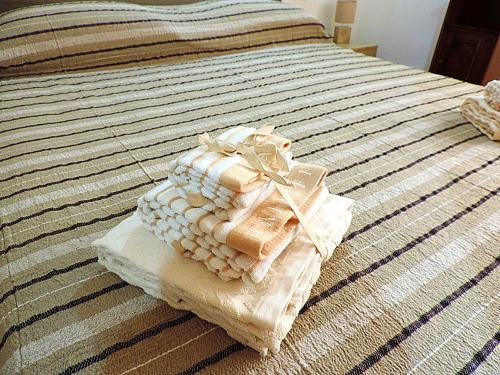 Postel nebo postele na pokoji v ubytování Sa Fabbrica de Sant'Anna