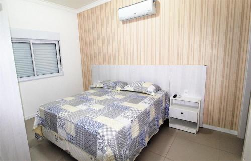Postelja oz. postelje v sobi nastanitve 1071 - Apartamento com 2 Suítes na Praia de Bombinhas,