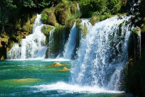 a waterfall in the middle of a river at Pousada Jubaia in Bonito