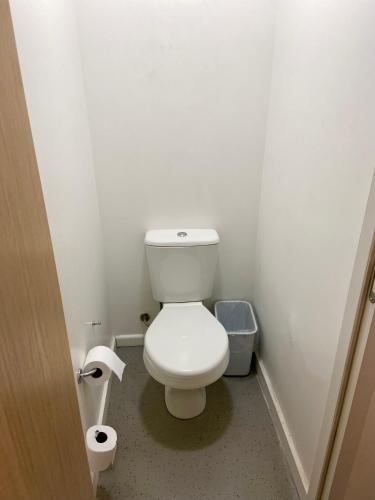 a bathroom with a white toilet in a room at ibis budget Manaus in Manaus