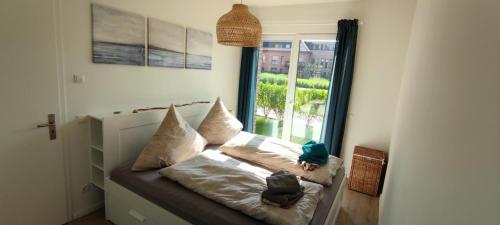 Katil atau katil-katil dalam bilik di Wohnen am Südstrand - Ferienwohnung 0 6