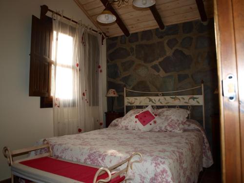 Postel nebo postele na pokoji v ubytování Apartamentos Rurales La Muralla II