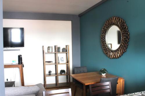a dining room with a table and a mirror at Downtown Mexico City, full apartment in Mexico City