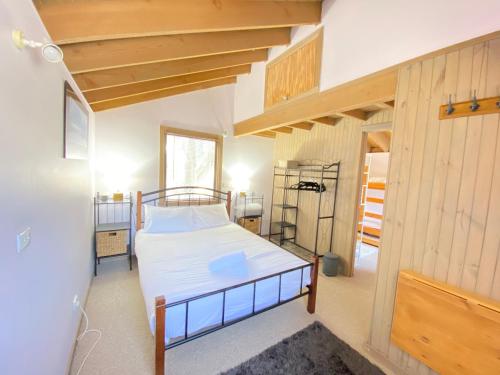 a small bedroom with a bed in a room at High Bernation Haus in Dinner Plain