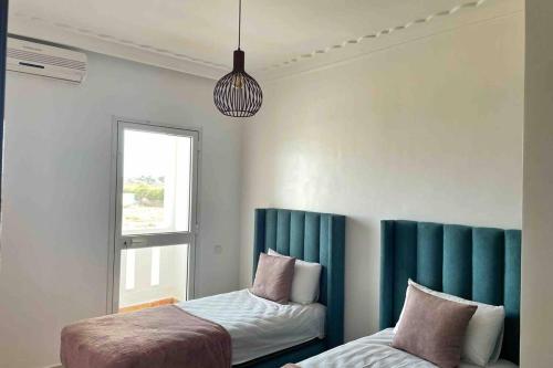 Postel nebo postele na pokoji v ubytování Appartement vue mer panoramique