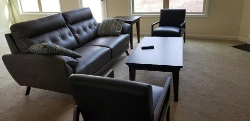 a living room with a couch and a table at Home at Tucker in Tucker