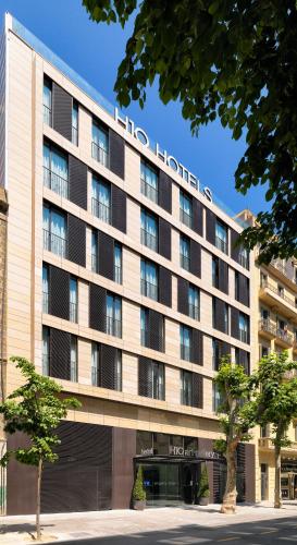 a hotel building with a sign on the front of it at H10 Art Gallery 4* Sup in Barcelona