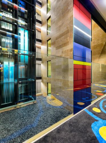a colorful glass wall in a building at H10 Art Gallery 4* Sup in Barcelona