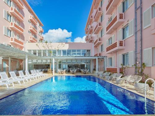 a swimming pool in the middle of a building at HOTEL SEABREEZE CORAL in Miyako-jima