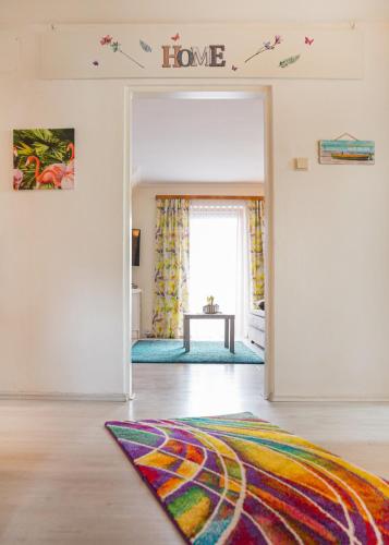 a living room with a door leading into a home at Haus Christina in Seeboden