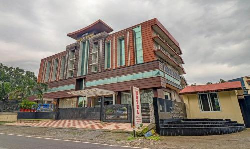 a building on the side of a street at Treebo Premium Pearl Avenue Banquets And Lawn in Dehradun