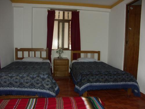 Un ou plusieurs lits dans un hébergement de l'établissement La Cabaña