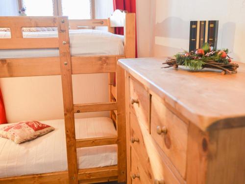 a bedroom with bunk beds and a desk with a ladder at Studio Valloire, 1 pièce, 4 personnes - FR-1-263-81 in Valloire