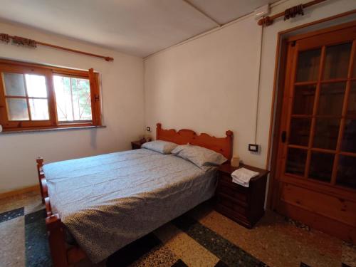 Posteľ alebo postele v izbe v ubytovaní Appartamento con giardino privato.