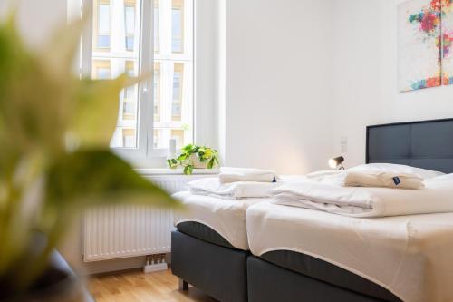 Katil atau katil-katil dalam bilik di FeelGood Apartments SmartLiving | contactless check-in