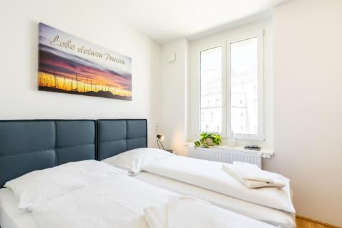 Katil atau katil-katil dalam bilik di FeelGood Apartments SmartLiving | contactless check-in